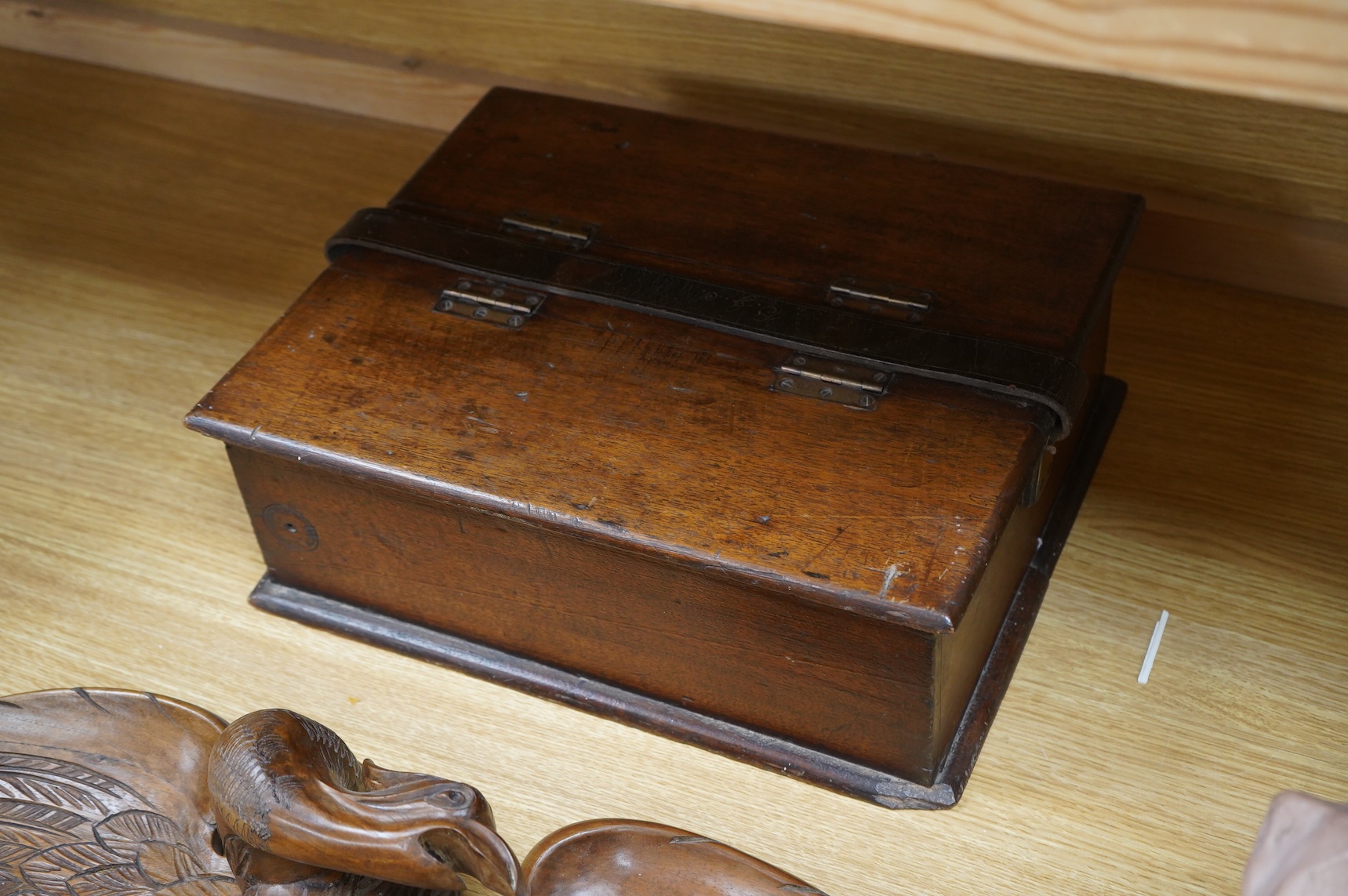 A mahogany leather-handled tool box and carved American eagle wall mount, largest 66cm wide